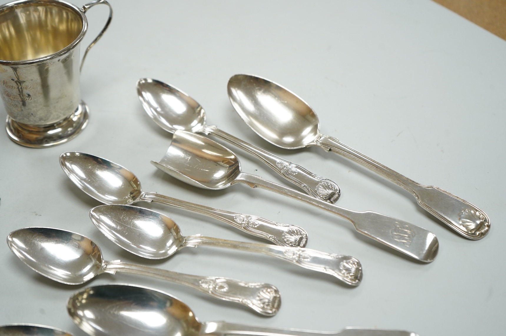 A collection of silver to include a set of six George IV silver Kings pattern teaspoons, by William Eaton, London 1824/5, five other items of silver flatware, a small trophy cup, christening mug and wine label, 13oz.